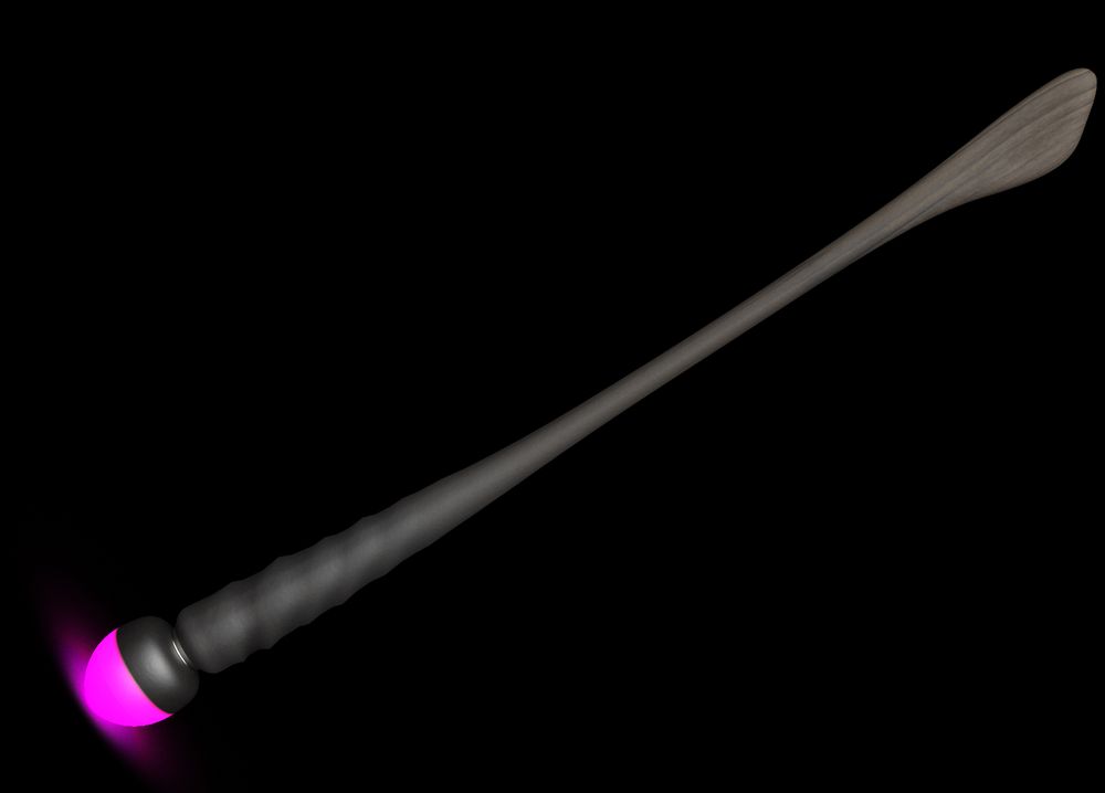Witches broom with vibrating messager head that glows magenta