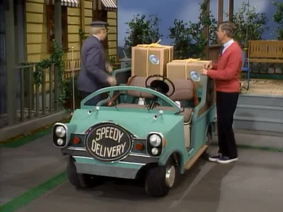 mr macfeeley has a speedy delivery electric car on mr rogers. it's a tiny open air one and it's bright robins egg blue 