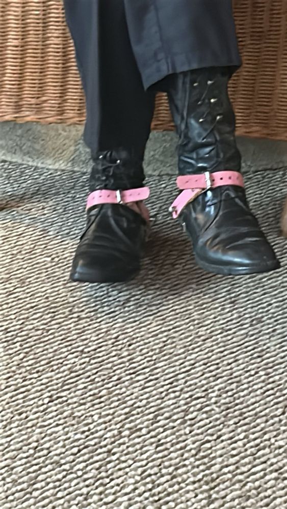 my moms feet with pink spurs on 
