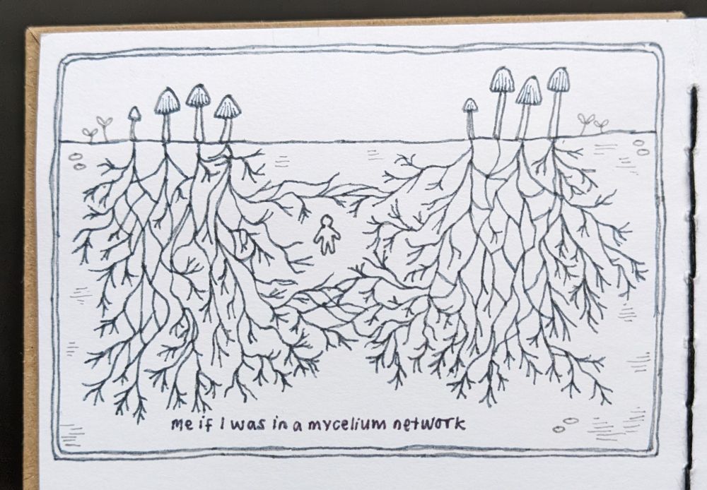 illustration of a mycelium network with a very tiny figure in the middle of all the roots, drawn in grey pen from a side on view with mushrooms growing above the soil and roots stretching down into the earth below. underneath the drawing is the caption "me if i was in a mycelium network"