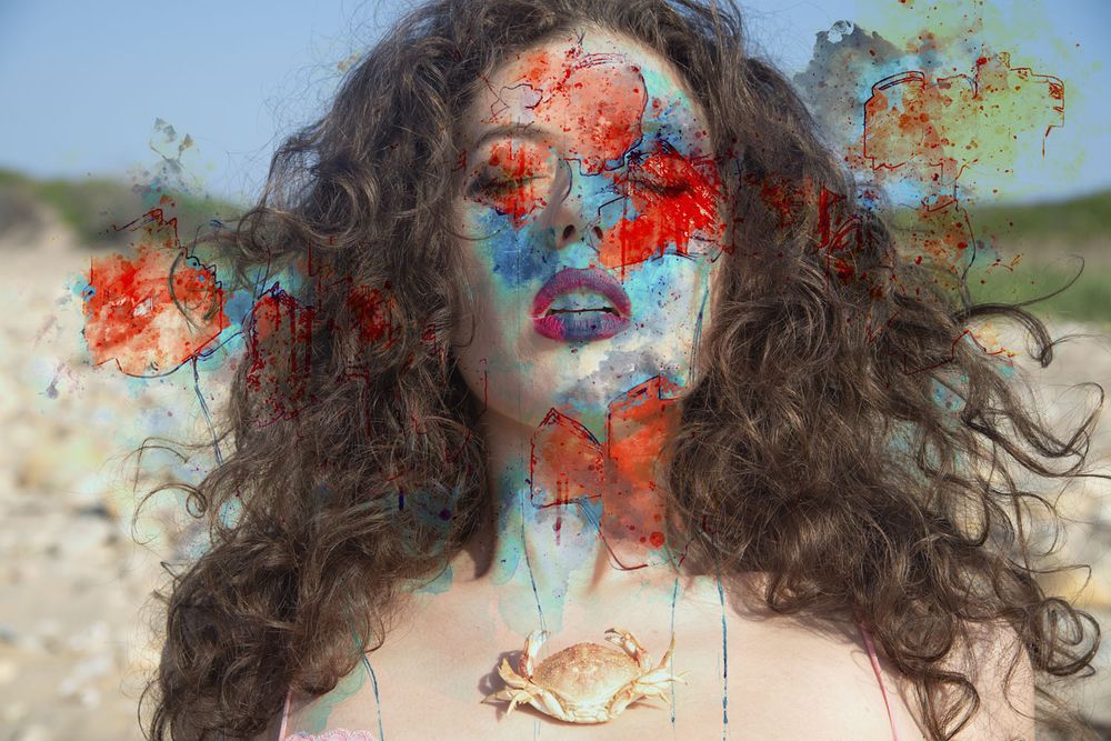 image of models face painted with flower petals