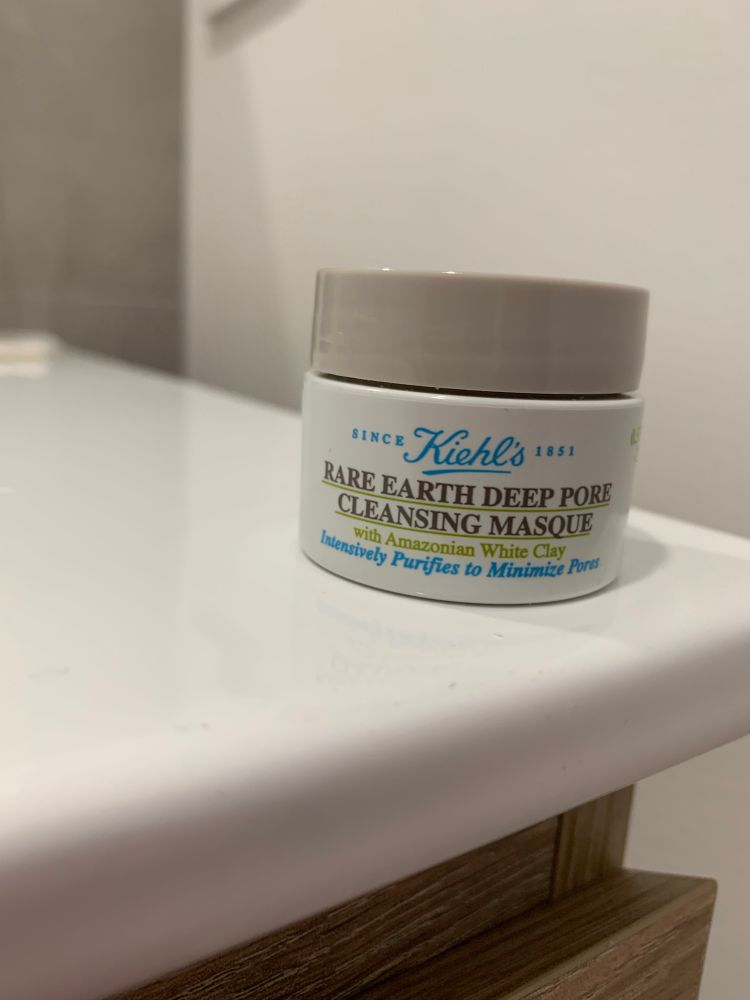 Grey-lidded, white container of Kiehl’s Rare Earth Deep Pore Cleansing Masque. In green writing underneath: with Amazonian White Clay. 