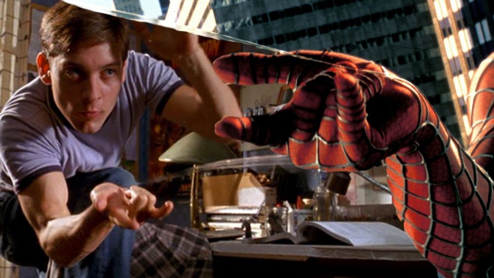 Toby Maguire's Spider-Man using a pose with his pinky finger, index finger, and thumb with his middle and ring fingers curled in symbolizing that Spider-Man is a Bisexual or Bisexual Ally.