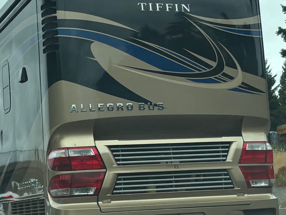 Photo of the ass end of a giant RV with quad taillights 