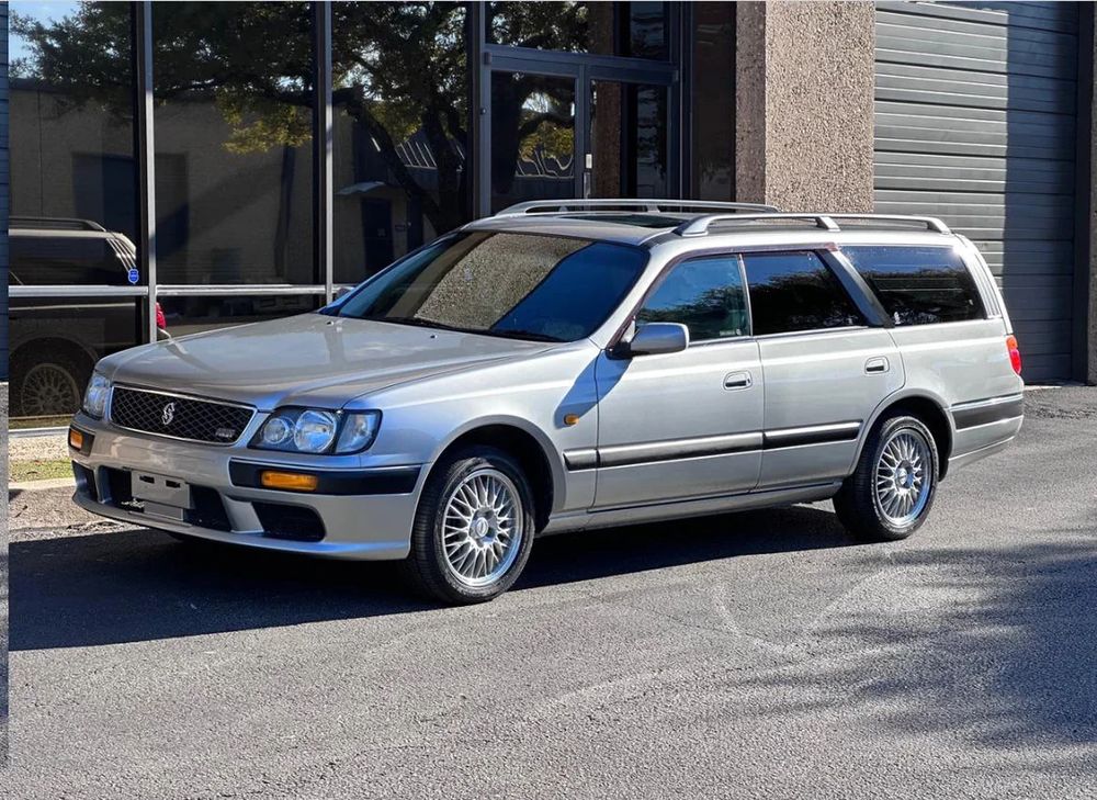 picture of a gold colored nissan sport wagon 