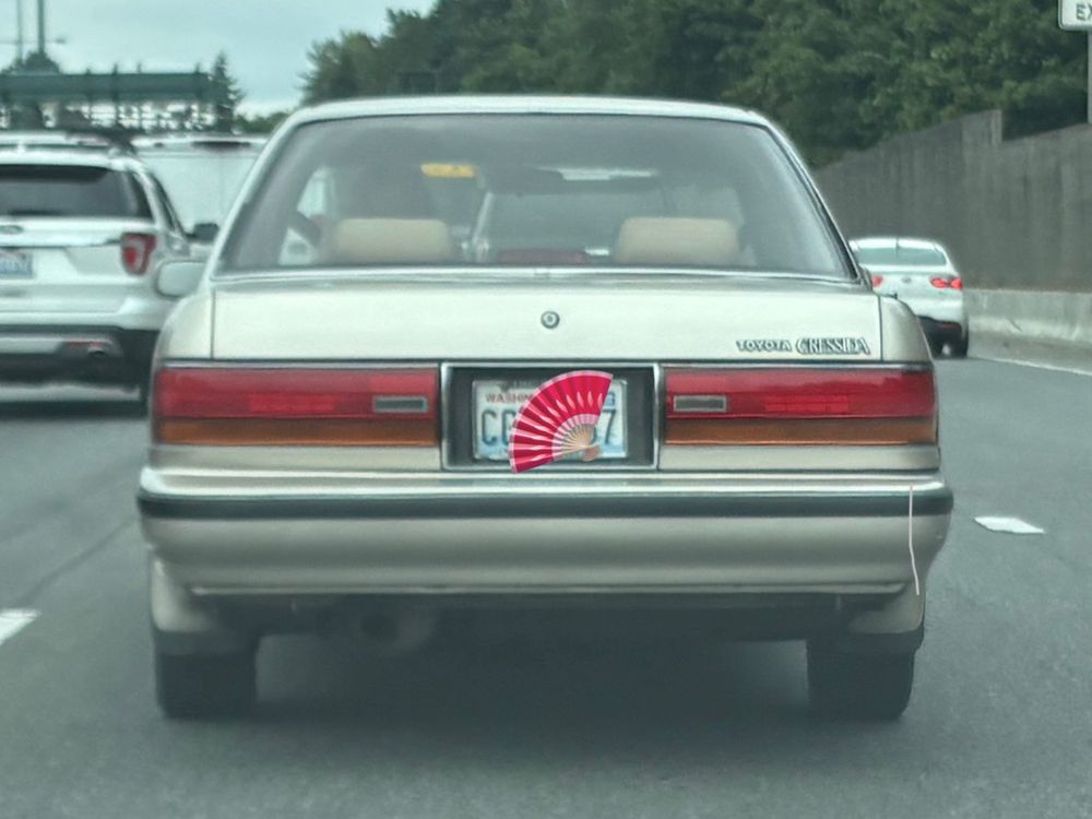 Absolutely perfect Toyota Cressida in Jewish Racing Gold on freeway.