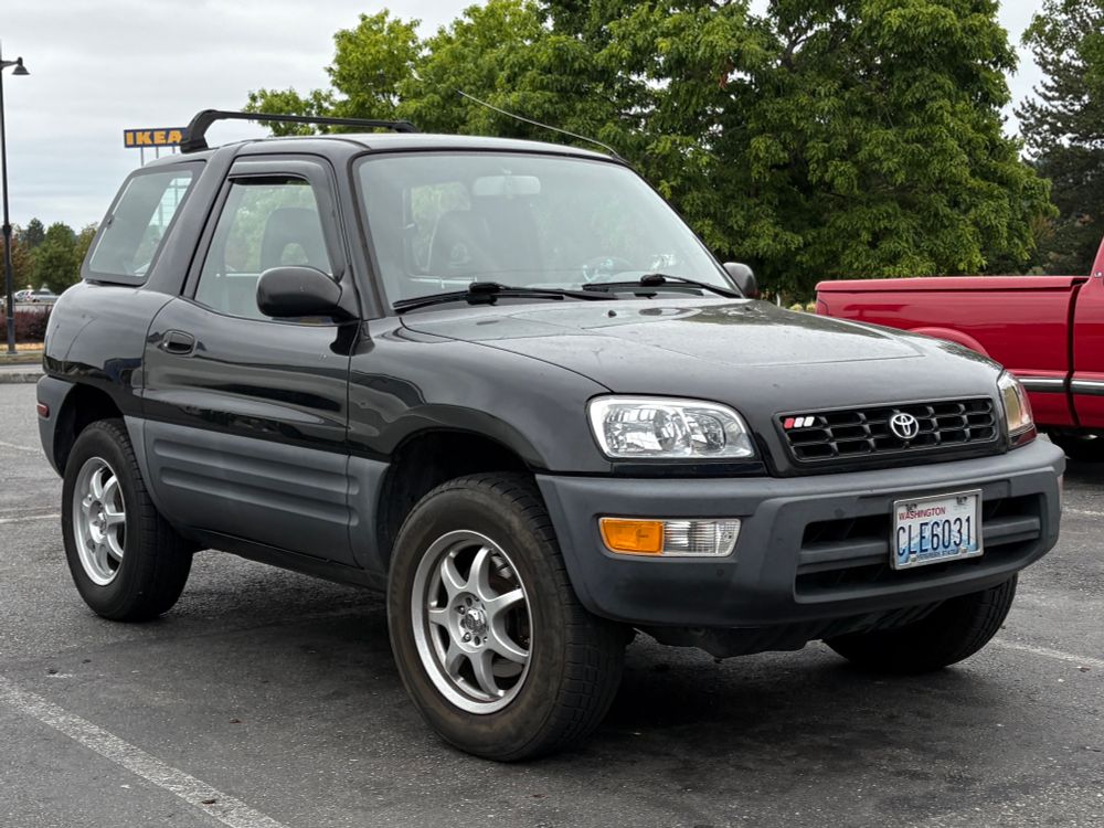 Picture of a black 2-door Toyota RAV4 SUV.