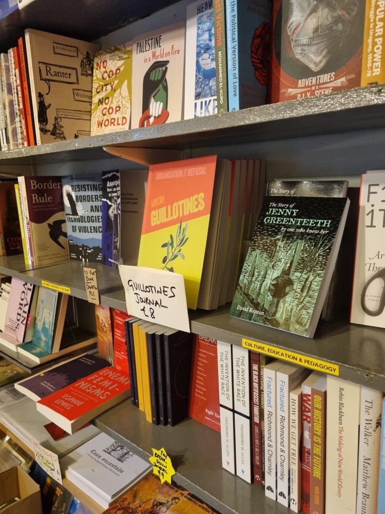 Book display at 56a bookshop in London. Shows 'The Story of Jenny Greenteeth' and beside her a copy of the Guillotines journal