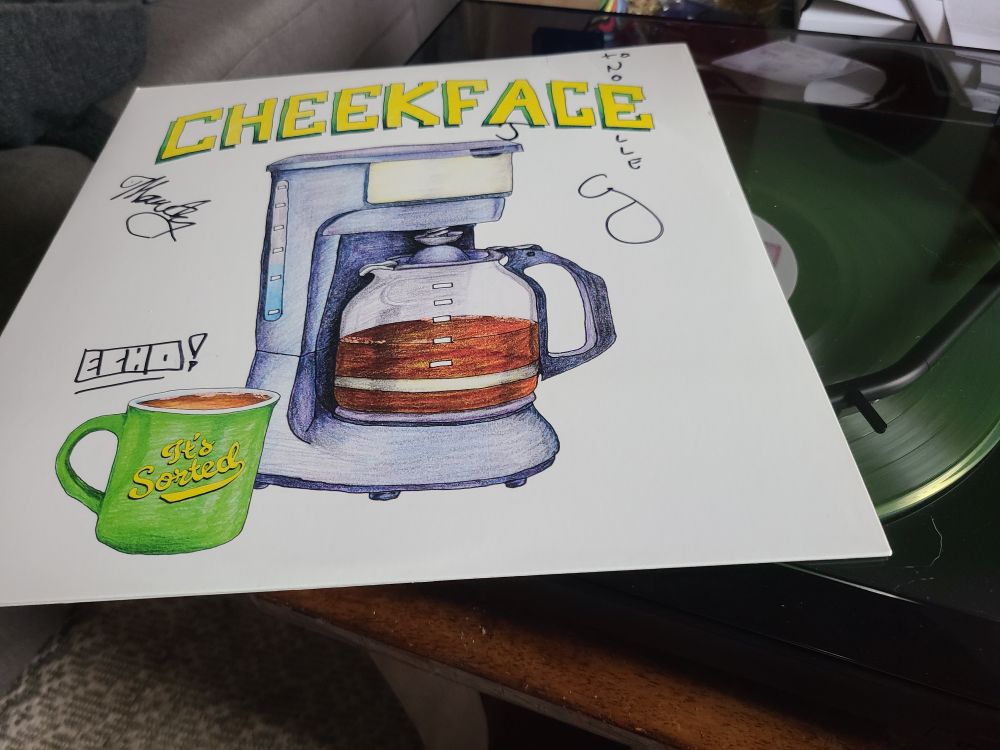 its sorted by cheekface in vinyl form with signatures from the band members and my name signed using the 'E' in cheekface