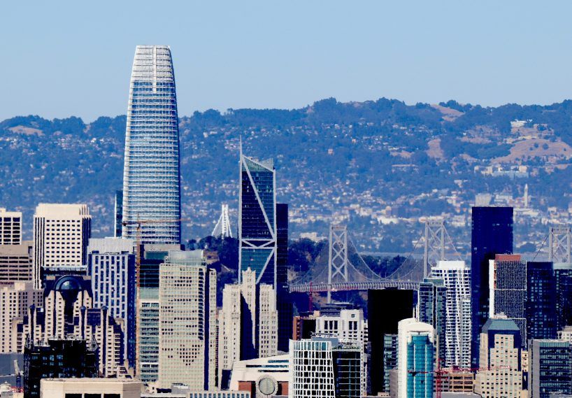 A picture of the San Francisco skyline, the Bay Bridge in the background. The skyline beautiful except it is desecrated by the enormous Salesforce Tower which is twice the height of all the other buildings plus it looks like a giant penis.