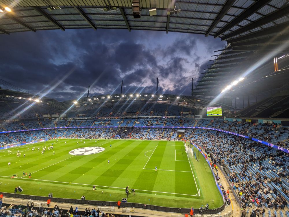 View from Block 302 of the East Stand at the Etihad Stadium. The sky is dark, the lights are on and the pitch looks in good condition.