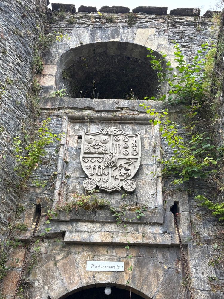 The coat of arms looks like a medieval object but a closer look reveals modern brands from the US and Europe.