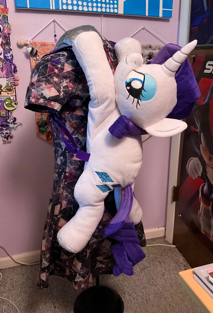 The Rarity backpack hung on the back of a dressform.