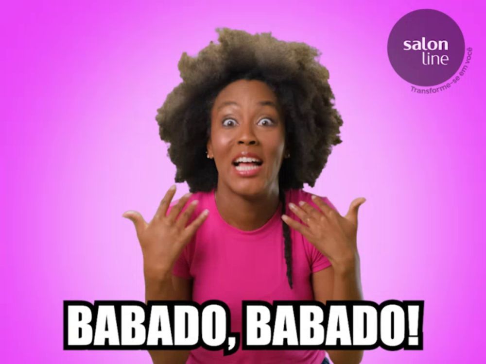 a woman says babado babado in a pink shirt