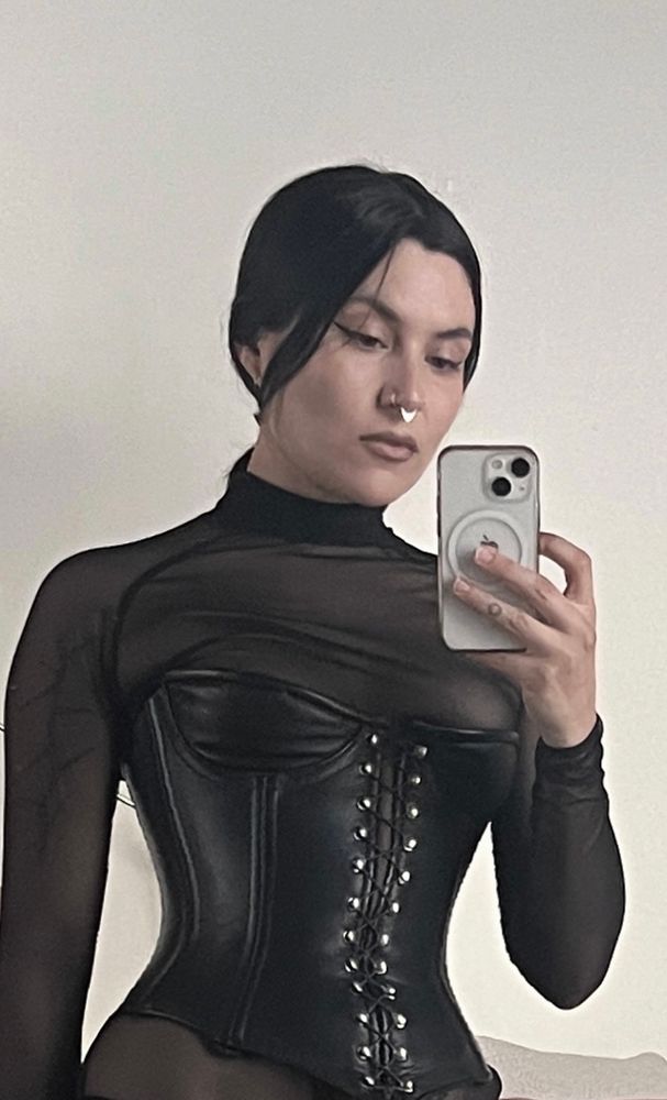 Close up of Domina’s upper body and face