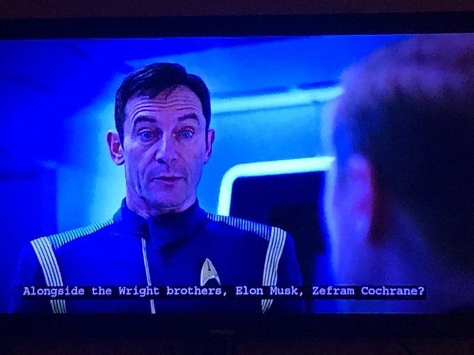 Actor Jason Isaacs playing "Lorca" in Star Trek: Discovery, wearing a uniform. The caption "Alongside the Wright brothers, Elon Musk, Zefram Cochrane?"