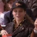 Elaine Benes wearing a Baltimore Orioles hat while sitting in the New York Yankees owner's seats