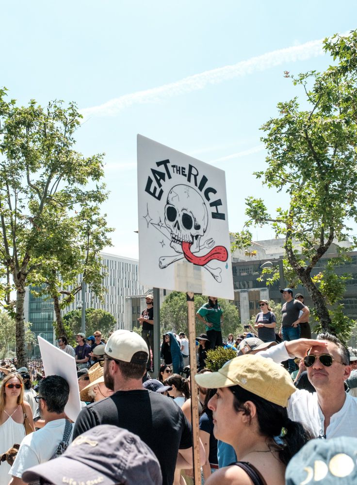 Eat the Rich sign at a rally
