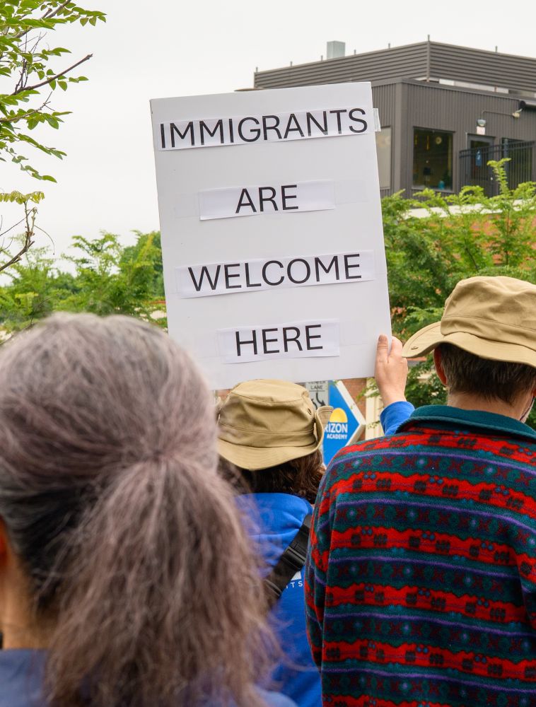 Immigrants are welcome here sign 