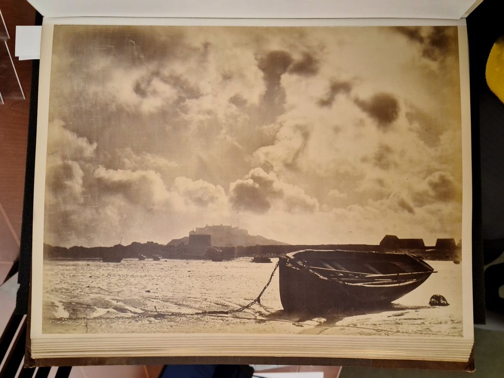 Rowing boat resting in the sand at low tide.