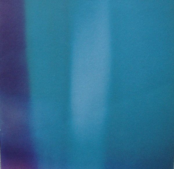 The cover of Lovesliescrushing's Xuvetyn. The visual is bluish-green blur on the right and on the left a bluish-purple streak. The album cover has a very hazy, feeling to it almost like being in a dreamy state.