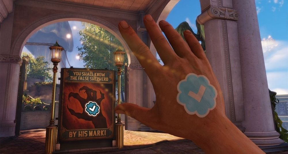 A first-person video game scene from Bioshock infinite shows a hand with a glowing blue "verified checkmark" symbol on the back, raised toward a poster. The poster reads "YOU SHALL KNOW THE FALSE SHEPHERD BY HIS MARK!" and depicts a clawed hand with the same checkmark symbol in its palm. The setting is a bright outdoor area with stone arches, ornate street lamps, and floating structures in the sky.