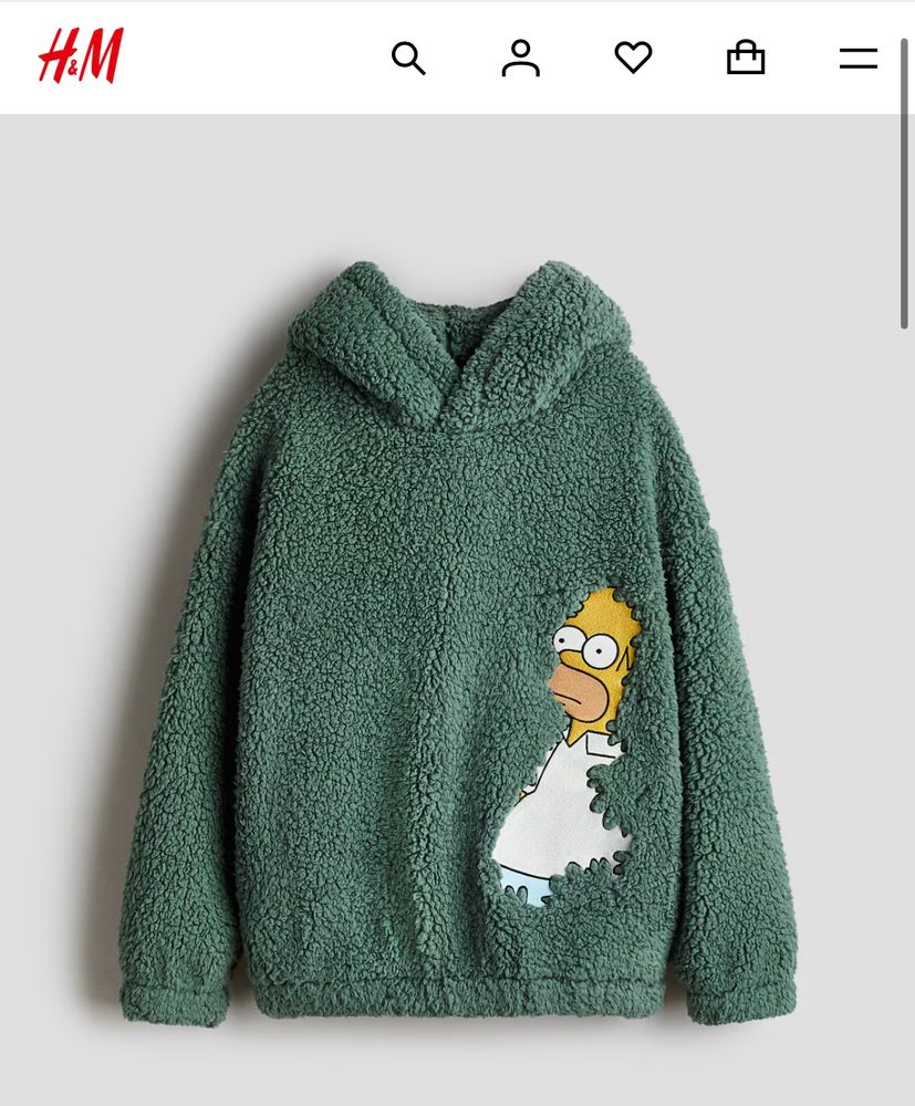 Flauschig grüner Hoodie, auf dem Homer Simpson gedruckt ist und es so aussieht wie das bekannte gif, bei dem er langsam in einem Busch verschwindet 