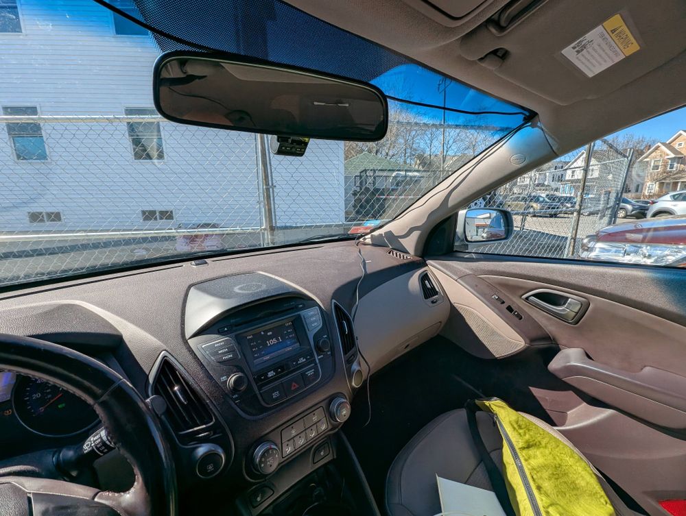 My car's passenger seat; USB cables frame the windshield obtrusively