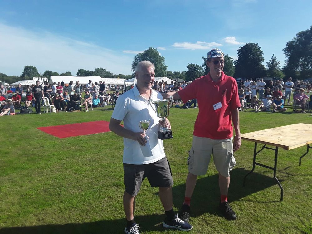 2024 World Aunt Sally Champion Roger Goodall  receives his trophy(left)
Photo credit: Rob Millea
