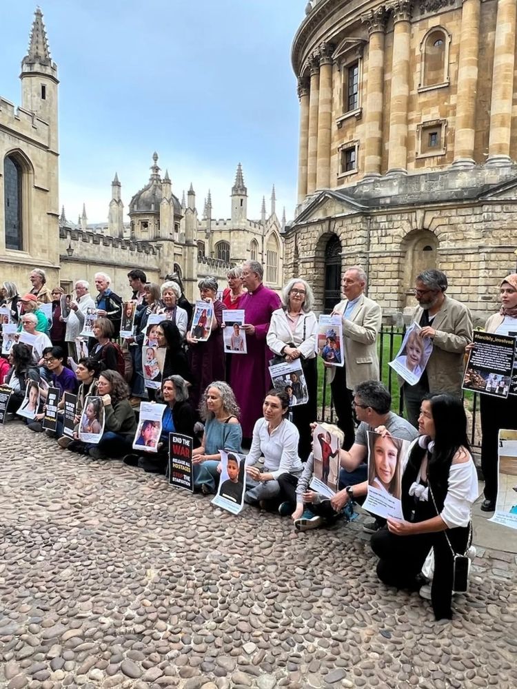 A gathering in Radcliffe Square. with the bishop and those standing in vigil (via https://www.facebook.com/UKFOST/posts/pfbid0k76RJrrQQBNdrs8c39M9GiocWeZyLVeAcS5epzspoci4FFQybNt1oNRiRXSxRAJEl)