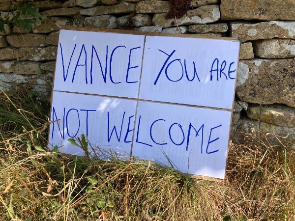 Placard in Dean reading "Vance you are not welcome"
