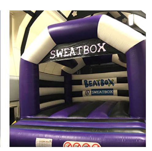 Bouncy castle with Sweatbox written on it.
Via Sweatbox website. 