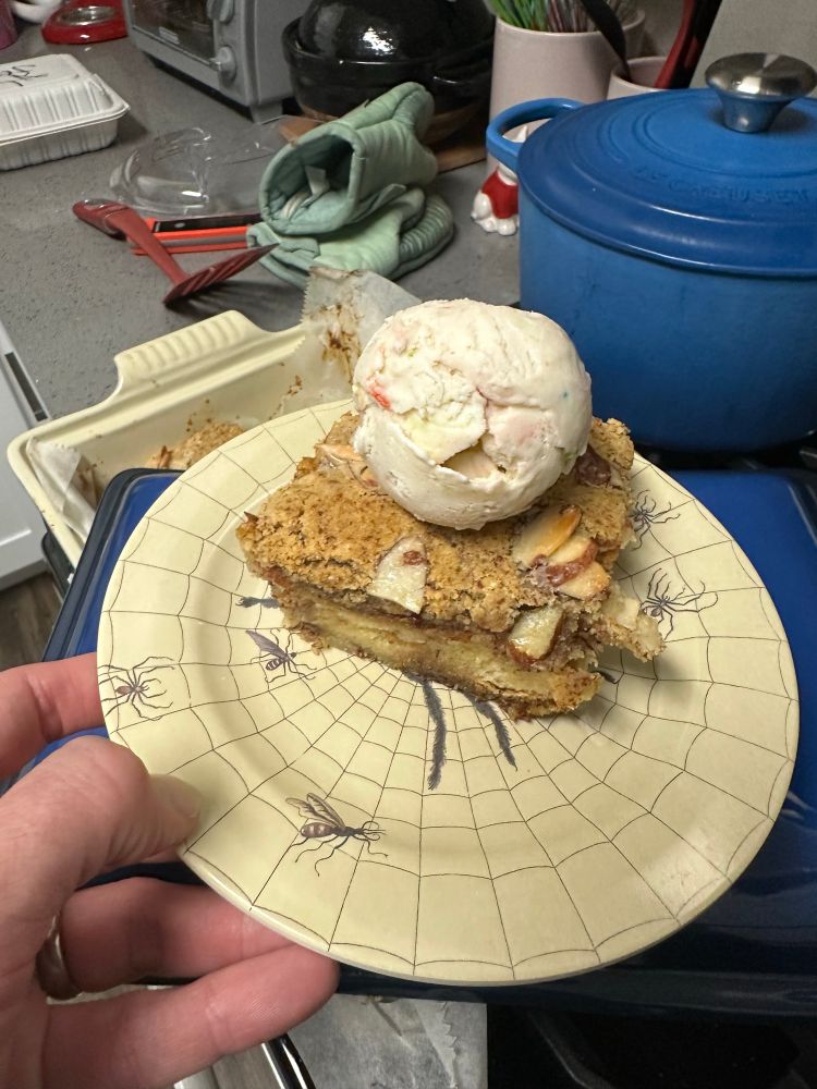 A slice of the bread pudding is topped with a scoop of Salt & Straw’s pot of gold and rainbows ice cream. The frangipane is significant and slightly crunchy