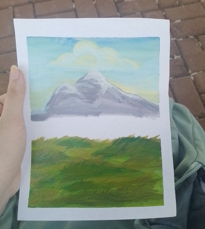 foto de uma pintura feita em papel, a pintura é formada por um céu ao amanhecer, com uma única nuvem, uma montanha e grama, há um espaço em branco entre a montanha e a grama que eu reservei para um futuro lago. 