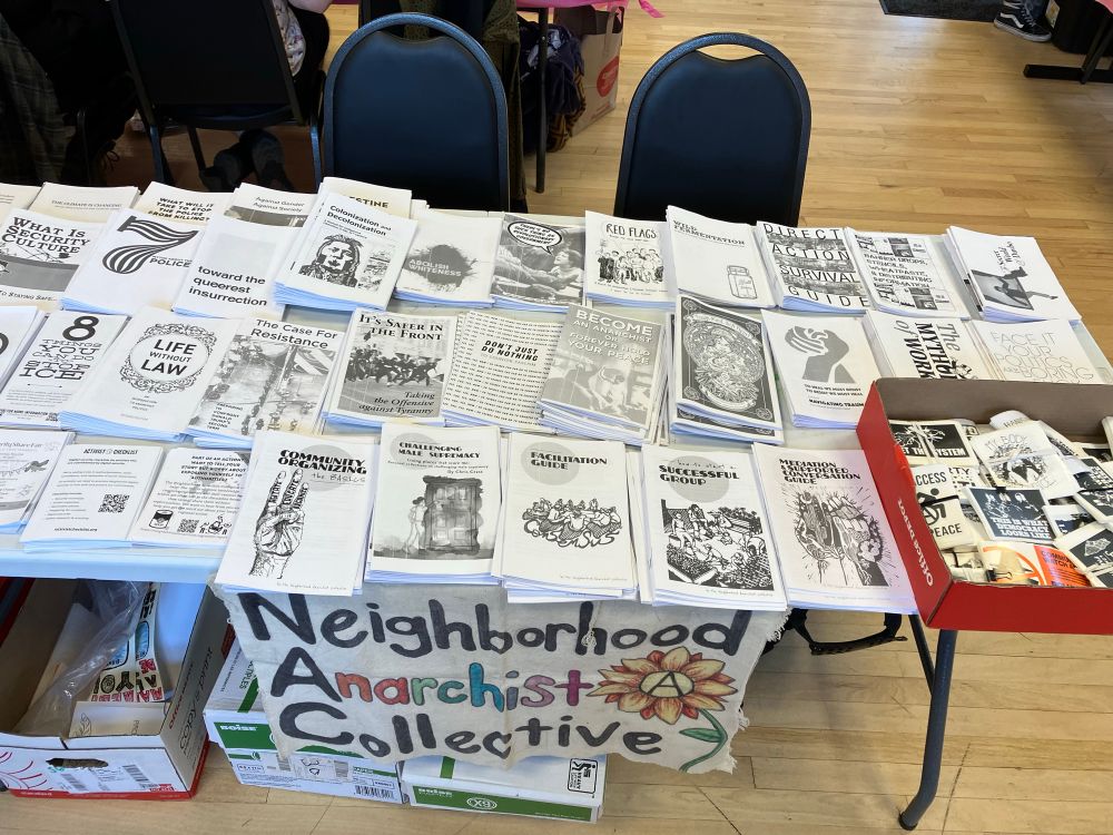 Picture of a table full of zines and stickers