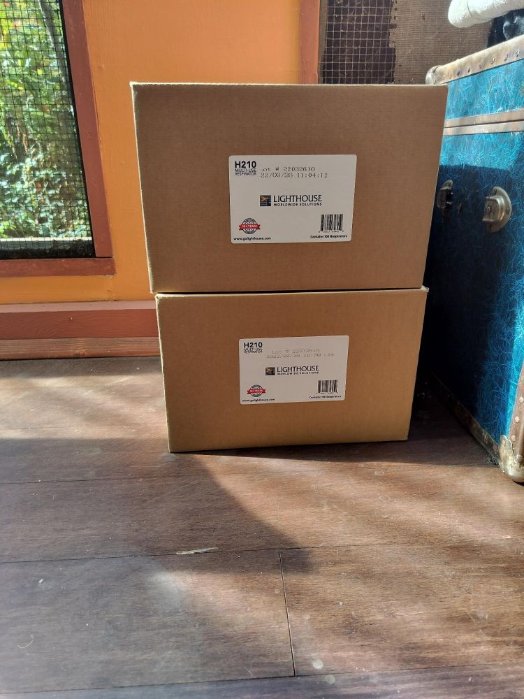A picture of two boxes containing KN95 masks, given to NAC as a donation
