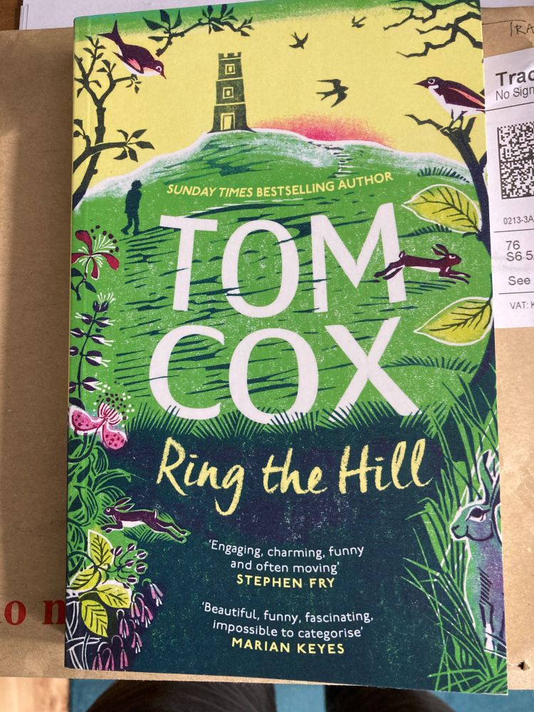A book - Ring the Hill by Tom Cox lying on an envelope.