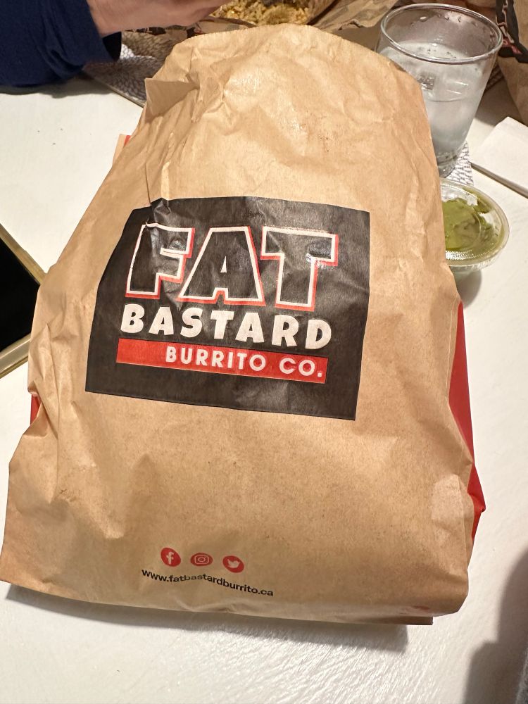 Bag from a restaurant titled fat bastard burrito co.
