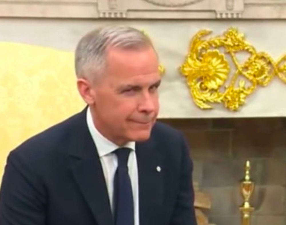 Mark Carney side eye toward the press