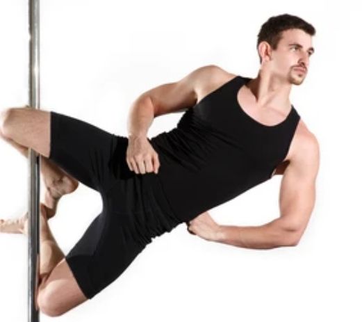 A man balancing on a pole.
