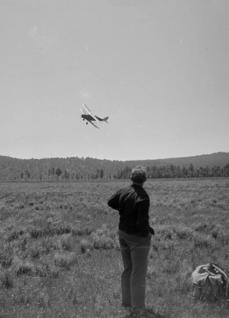 📷 Edgar Richard Williams 
Unbeknownst to Williams he has hit upon an iconic scene for Hitchcock fans. A black & white photograph of a man standing in a field looking up at a biplane as it turns to presumably land and pick him up. By his side is his bag. The Hitchcock scene, where the plane does not land but instead attacks, is from North by Northwest which I will quote post. Interestingly, I doubt if it is possible for me to see this photograph as intended unless it was intended to be suspenseful with the possibility of danger.
