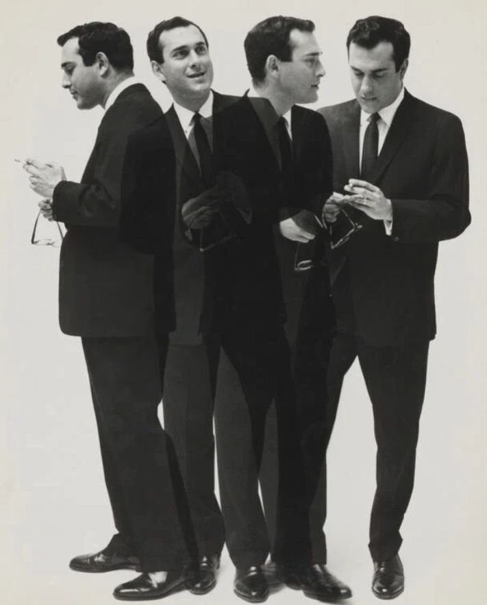📷 Cecil Beaton 
Four Harold Pinters from the same photoshoot, dressed alike, cigarette and glasses in hand but standing and looking in different directions against a plain white background. They would form a group as if at a party if they didn't overlap each other. As I have already posted something today relating to Monty Python I could title this photograph Pinter Island.