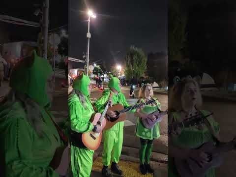 Frogs play to crowd of protesters while they get teargassed