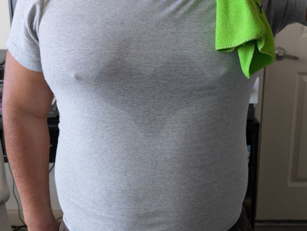 Sweat pooled in the center of my grey t-shirt in the shape of a heart.