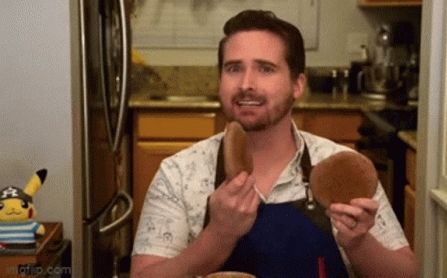 A looping gif of a caucasian man in a white short-sleeved shirt and a blue apron looking both mildly disturbed and worried as he clacks together a pair of hardtack biscuits he's just made.
The show can be found on YouTube, called Tasting History with Max Miller. The host, Max, is the man featured in the gif, and it's a running gag in the channel to jump-cut to this moment everytime he mentions hardtack in a video.