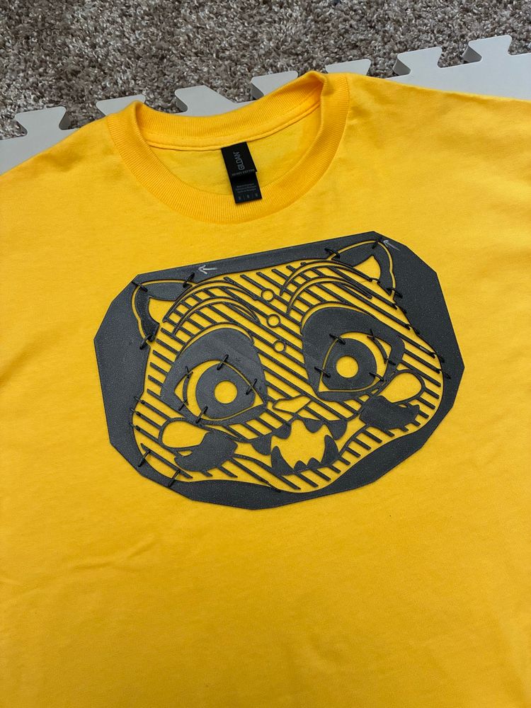 the stencil in approximate position on the shirt (i added paper around it to mask off the rest of the shirt)