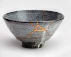 Kintsugi is a Japanese art form that involves repairing broken pottery and other ceramics using lacquer mixed with powdered gold, silver, or platinum. The term 'Kintsugi' translates to 'joining with gold.' Rather than concealing cracks, Kintsugi accentuates them with gold, telling the object's story and finding beauty in its imperfections.