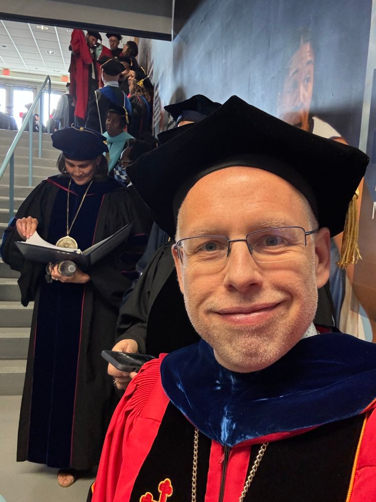 Me in my funny academic robes, with other faculty waiting to begin graduation ceremony. 