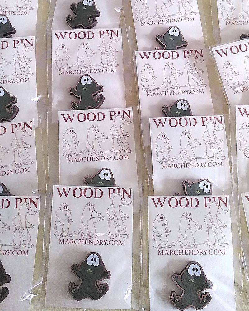 A photo of some wooden pins of an animated character.