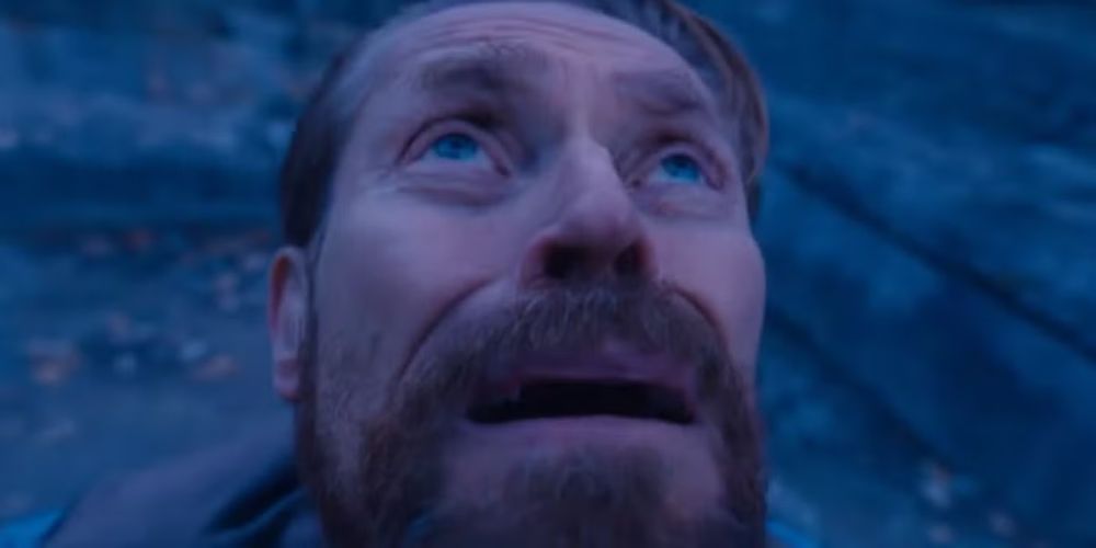 Willem Dafoe looking up at the post above in shock and horror